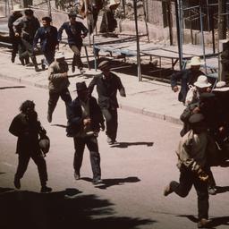 Tibetan man carrying bag am...