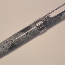 Pen with fingerprint design.