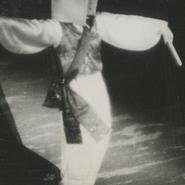 A male dancer is wearing ha...