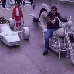 Man riding gray motorcyle n...