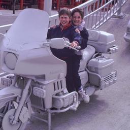 Children riding gray motorc...