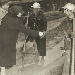 Frances Perkins shakes hand...