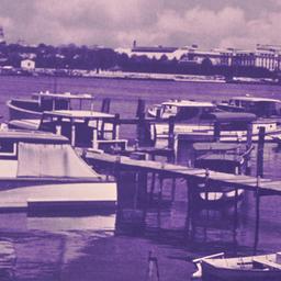 Docked boats with domed bui...