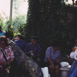 People resting on benches.