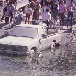 Gray pickup truck and bicyl...