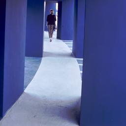 Woman walking through doorw...