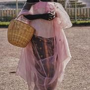 Woman in pink mesh to marke...