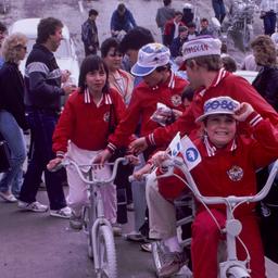 Children in red jackets rid...