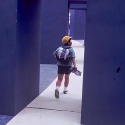 Child walking through doorw...