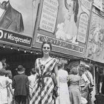 Woman posing signs that adv...