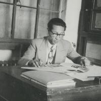 A Korean male wearing glass...