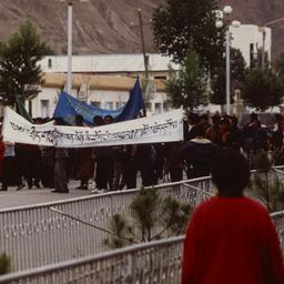 Tibetan demonstrators march...