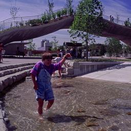 Child playing in water feat...