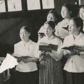 A Korean film crew taping a...