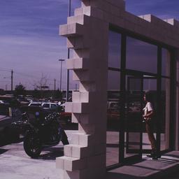 Woman in freestanding doorway.