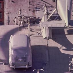 People viewing gray vehicle...