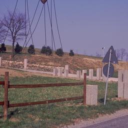 Sculpture in field, seen fr...