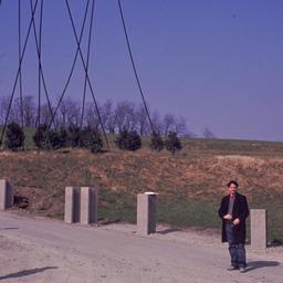 Sculpture in field, seen fr...