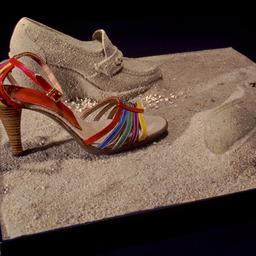 Shoe display with sand shoes.