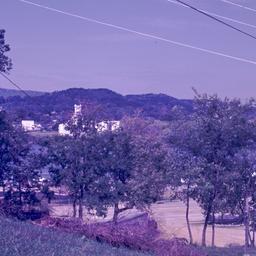 View of hill and parking lot.