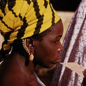 Woman voter holding registr...