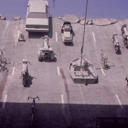 Gray vehicles at end of und...