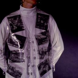 Woman wearing plastic vest ...