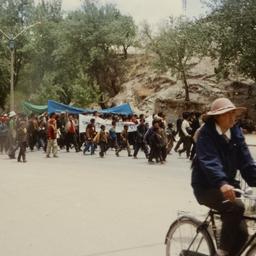 Bicyclists riding past Tibe...