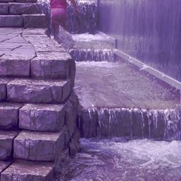 Child climing water feature.