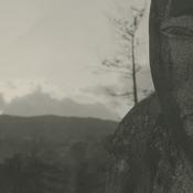 A stone sculpture of a male...