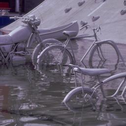 Gray motorbike and bicycles...
