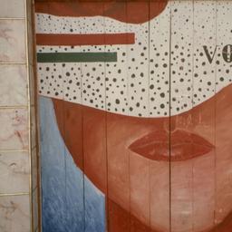Mural on building with word...