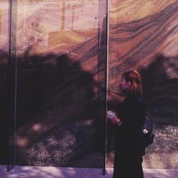 Exterior view, woman standi...