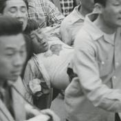 A wounded demonstrator is b...