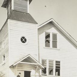 Rev. Floyd Burnett Standing...