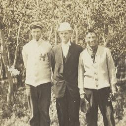 Three Men Posing for the Ca...