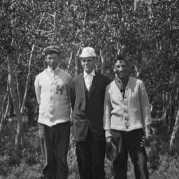 Three Men Posing for the Ca...