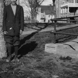 Young Man Standing on the G...