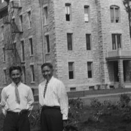 Two Men in front of Building