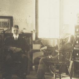 Two Men Sitting in an Office