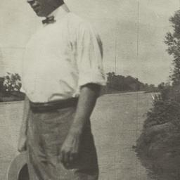 Young Man Holding a Hat Sta...