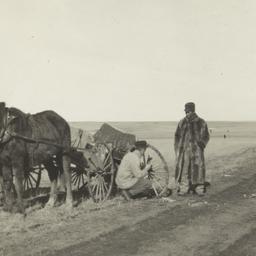 Two Men Repairing a Broken ...
