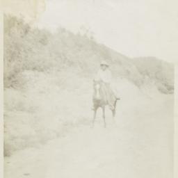 Dennis Fredo Riding a Horse