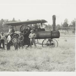 Group of Men with a Steam T...