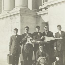 Young Men in Suits Holding ...