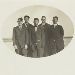 Five Men Standing in a Fiel...