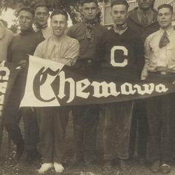 Group of Men Holding Pennan...