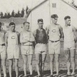 Line of Young Men in Shorts...