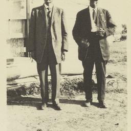 Two Gentlemen Wearing Suits...