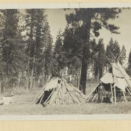 Two Tipis in a Clearing in ...